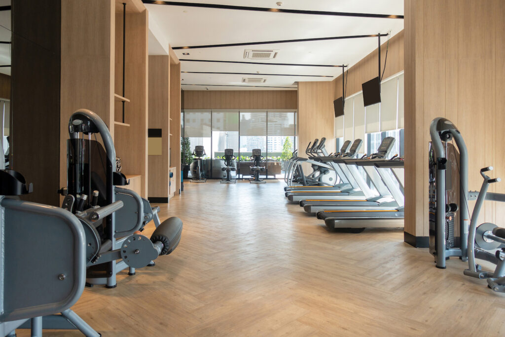 Modern fitness center with gym equipment decoration.