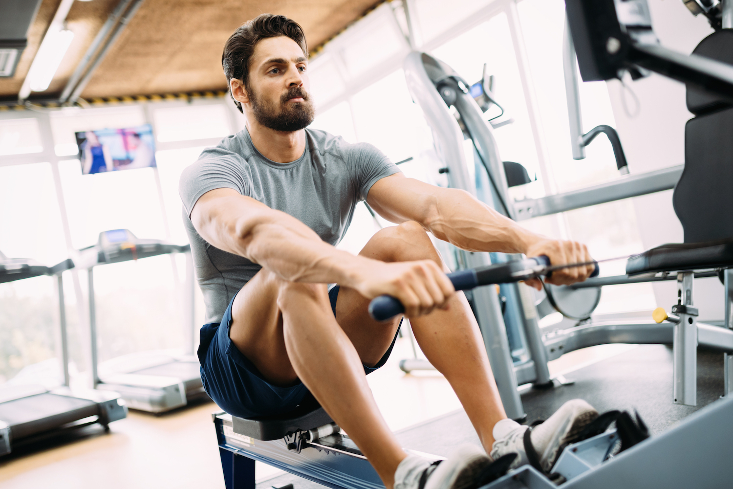 man doing exercises in gym